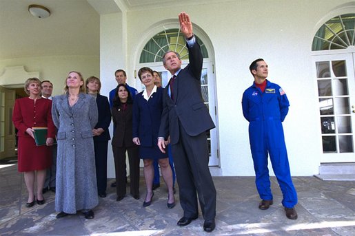 President George W. Bush gives a tour of the Rose Garden to crew members of Space Shuttle Endeavour Mission STS-113 and Expeditions 1,4,and 5 Wednesday, Jan. 15, 2003. The next orbiter launch will be Thursday, Jan. 16, carrying the crew of the Space Shuttle Columbia Mission STS-107 to the International Space Station. White House photo by Tina Hager.