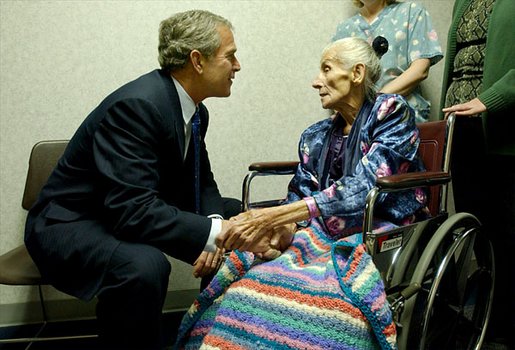 President George W. Bush visits with 94-year-old Anna Tovcimak, who is a hospice patient, after a roundtable discussion on Medical Liability Reform at Mercy Hospital in Scranton, Pa, Jan. 16, 2003. "I appreciate you all. giving me a chance to talk about a significant problem which faces America," said President Bush in his remarks. "And that problem is the fact that our medical liability system is broken, and therefore, a lot of Americans don't have access to affordable health care." White House photo by Tina Hager