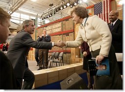 President George W. Bush greets employees at JS Logistics in St. Louis, Mo., after discussing his economic stimulus package Wednesday, Jan. 22, 2003. "It's important for our fellow Americans to understand that the strength of our country, the strength of our economy really depends upon the strength of the small business community all across America. And that's why I'm here today in this small business, to remind people about the importance of small business," President Bush said.  White House photo by Paul Morse