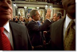 After delivering his State of the Union speech, President Bush waves to his wife, Laura Bush, as he leaves the House Chamber at the U.S. Capitol Tuesday, Jan. 28, 2003.   White House photo by Eric Draper