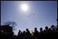 Honoring the seven astronauts who died in the Space Shuttle Columbia disaster, jets fly over the crowd in a missing man formation during a memorial service at the NASA Lyndon B. Johnson Space Center Tuesday, Feb. 4, 2003. White House photo by Paul Morse.