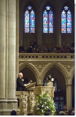Vice President Dick Cheney speaks during a memorial service at the National Cathedral in Washington, D.C., Thursday, Feb. 6, 2003 for the seven astronauts who died in the Feb. 1 Space Shuttle Columbia tragedy. "The crew of the Columbia was united not by faith or heritage, but by the calling they answered and shared," the Vice President said. "They were bound together in the great cause of discovery. They were envoys to the unknown. They advanced human understanding by showing human courage."   White House photo by David Bohrer