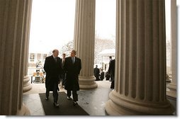 John Snow, the newly appointed Secretary of Treasury, walks with President George W. Bush to his swearing-in ceremony at The Treasury Building Friday, Feb. 7, 2003.   White House photo by Paul Morse