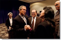 After meeting privately with the leadership and graduates of Campus for Human Development, President George W. Bush talks with program graduates David Barclay, left, LuAnn Nicholas, center, and Bob Head at Opryland in Nashville, Tenn., Feb. 10, 2003.  White House photo by Tina Hager