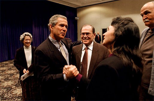 After meeting privately with the leadership and graduates of Campus for Human Development, President George W. Bush talks with program graduates David Barclay, left, LuAnn Nicholas, center, and Bob Head at Opryland in Nashville, Tenn., Feb. 10, 2003. White House photo by Tina Hager