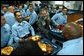 President George W. Bush shares a light moment after lunch with sailors aboard the USS Philippine Sea at Naval Station Mayport in Mayport, Fla., Thursday, Feb. 13, 2003. White House photo by Eric Draper.