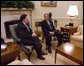 President George W. Bush meets with NATO Secretary General Lord Robertson in the Oval Office Wednesday, Feb 19, 2003.  White House photo by Eric Draper