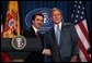 President George W. Bush and President Jose Maria Aznar of Spain shake hands at the end a joint press conference at the Bush Ranch in Crawford, Texas, Saturday, Feb. 22, 2003.  White House photo by Eric Draper