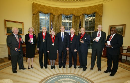 President George W. Bush stands with the recipients of the 2002 National Humanities Medal in the Oval Office Thursday, Feb. 27, 2003. From left, they are: Joseph McDade, who accepts the award on behalf of Frankie Hewitt of Ford's Theatre; Ellen Carroll Walton, who accepts the award on behalf of the Mount Vernon Ladies' Association of the Union; Dr. Donald Kagan of Yale University; author Patricia MacLachlan; Brian Lamb of C-SPAN; Art Linkletter of the United Seniors Association; Frank Conroy, who accepts the award on behalf of the Iowa Writers' Workshop; and Justice Clarence Thomas, who accepts the award on behalf of Dr. Thomas Sowell of the Hoover Institution. White House photo by Paul Morse.