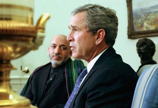 President George W. Bush and President Hamid Karzai of Afghanistan answer questions from the press after a meeting in the Oval Office Thursday, Feb. 27, 2003. White House photo by Tina Hager.