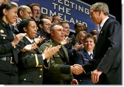 After speaking, President George W. Bush greets a few of the new employees at the U.S. Department of Homeland Security at the Ronald Reagan Building and International Trade Center in Washington, D.C., Friday, Feb. 28, 2003.   White House photo by Paul Morse