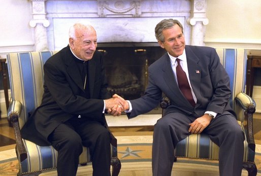 President George W. Bush meets with Cardinal Pio Laghi, Pope John Paul II's envoy, in the Oval Office Wednesday, March 5, 2003. White House photo by Paul Morse.