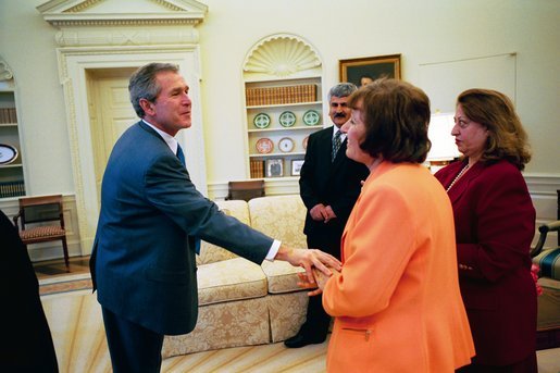 President George W. Bush says good bye to Dr. Katrin Michael, foreground, Della Jaff and Idres Hawarry in the Oval Office Friday, March 14, 2003, after speaking with them. The three are from the Kurdish area of Iraq where a chemical weapons attack killed 5,000 citizens 15 years ago this weekend. Thousands died in the days following the attack on Halabja and an estimated 10,000 people still suffer from the attack. Idres Hawarry survived the attack on Halabja, Dr. Michael survived a similar attack in another Kurdish village and friends and family of Della Jaff were killed in Halabja. White House photo by Eric Draper.