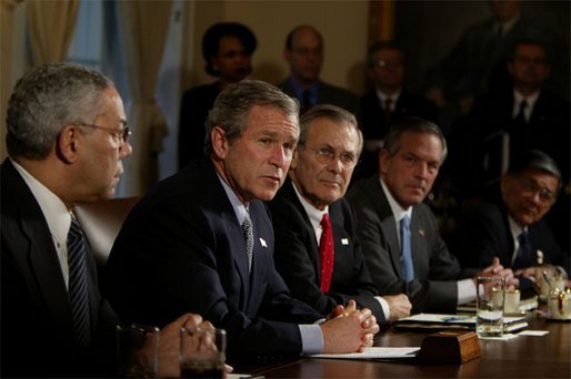 President George W. Bush meets with his Cabinet the day after beginning the disarmament of Iraq in the Cabinet Room Thursday, March 20, 2003. Pictured with the President are, from left, State Secretary Colin Powell, Defense Secretary Donald Rumsfeld, Commerce Secretary Don Evans and Transportation Secretary Norman Mineta. White House photo by Paul Morse.