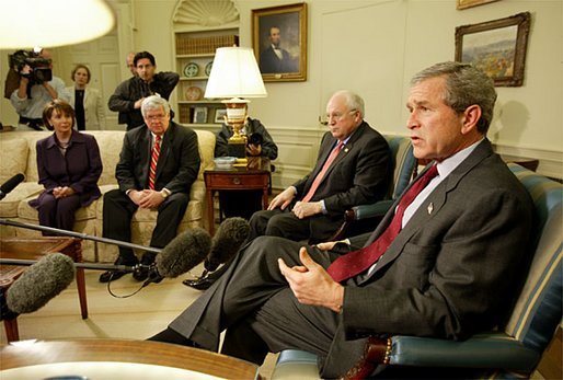 President George W. Bush talks with the press during a meeting with congressional leaders in the Oval Office Friday, March 21, 2003. Pictured with the President are, from left, House Minority Leader Nancy Pelosi, D-Calif., Speaker of the House Dennis Hastert, R-Ill., and Vice President Dick Cheney. White House photo by Paul Morse