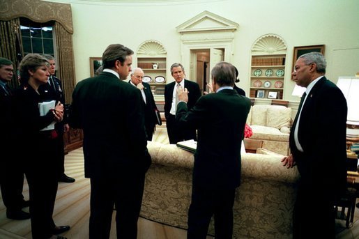 On Wednesday evening, March 19, 2003, President George W. Bush meets with his national security and communications advisors after authorizing military operations. Present, from left, are Steve Hadley, Deputy National Security Advisor; Karen Hughes, special advisor to the President; Chairman of the Joint Chiefs of Staff Richard B. Myers; Dan Bartlett, Communications Director; Vice President Dick Cheney, Secretary of Defense Donald Rumsfeld; National Security Advisor Condoleezza Rice; and Secretary of State Colin Powell. White House photo by Eric Draper.