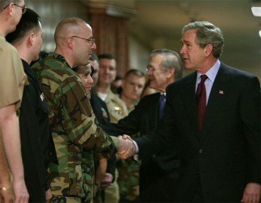 After delivering his remarks, President George W. Bush greets troops at the Pentagon Tuesday, March 25, 2003. White House photo by Paul Morse.
