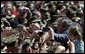 President George W. Bush greets Marines and their families after speaking at Camp Lejeune in Jacksonville, N.C., Thursday, April 3, 2003. White House photo by Paul Morse