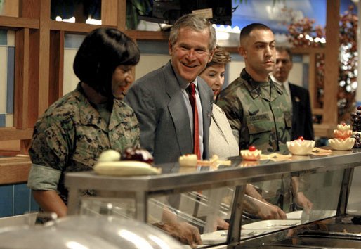 President George W. Bush and Mrs. Bush are served lunch with Marines at Camp Lejeune in Jacksonville, N.C., Thursday, April 3, 2003. White House photo by Paul Morse.