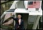 President George W. Bush waves as he departs for Camp David from the South Lawn Friday, April 4, 2003. White House photo by Paul Morse.