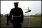 President George W. Bush arrives aboard Marine One at Hillsborough Castle in Northern Ireland, Monday, April 7, 2003. White House photo by Eric Draper.