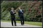 President George W. Bush and British Prime Minister Tony Blair walk through the grounds of Hillsborough Castle in Northern Ireland, Monday, April 7, 2003. White House photo by Eric Draper.