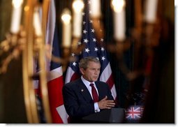 President George W. Bush is reflected in a mirror during a press conference with British Prime Minister Tony Blair at Hillsborough Castle near Belfast, Northern Ireland, Tuesday, April 8, 2003. White House photo by Paul Morse