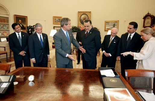 President George W. Bush explains the history of his desk during a meeting with Central American presidents in the Oval Office Thursday, April 10, 2003. From left, they are, Presidents Francisco Flores of El Salvador, Ricardo Maduro of Honduras, Abel Pacheco of Costa Rica, Enrique Bolanos of Nicaragua, and Alfonso Portillo of Guatemala. White House photo by Paul Morse