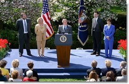 President George W. Bush discusses the economy in the Rose Garden Tuesday, April 15, 2003. Accompanying President Bush on stage are, from left, small business owners Tim Barrett, Christine Bierman, Frank Fillmore and Karla Aaron.  White House photo by Paul Morse