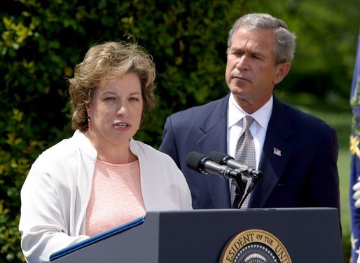 President George W. Bush listens to Betsy Rogers, 2003 National Teacher of the Year, in a ceremony in the East Garden Wednesday, April 30, 2003. Rogers is a 1st and 2nd grade teacher at Leeds Elementary School in Leeds, Ala. White House photo by Paul Morse