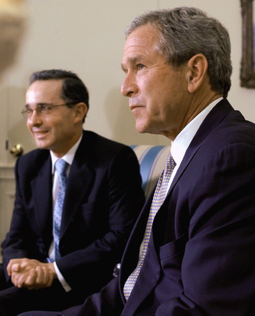 President George W. Bush and President of Colombia Alvaro Uribe take questions from the press in the Oval Office Wednesday, April 30, 2003. White House photo by Tina Hager