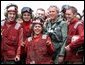 President George W. Bush poses with flight deck crew of the USS Abraham Lincoln May 1, 2003. White House photo by Paul Morse