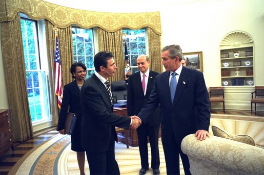 President George W. Bush says goodbye to Danish Prime Minister Anders Fogh Rasmussen in the Oval Office Thursday, May 8, 2003. Also present are National Security Advisor Condoleezza Rice and Denmark’s Ambassador to the U.S. Ulrik Federspiel. White House photo by Eric Draper