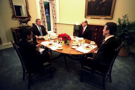 President George W. Bush has breakfast with Danish Prime Minister Anders Fogh Rasmussen, far right, National Security Advisor Condoleezza Rice, left, and Denmark’s ambassador to the U.S. Ulrik Federspiel, in the private dining room of the White House Thursday, May 8, 2003. White House photo by Eric Draper