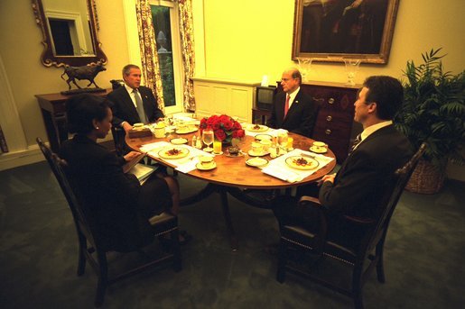 President George W. Bush has breakfast with Danish Prime Minister Anders Fogh Rasmussen, at right, National Security Advisor Condoleezza Rice and Denmark’s Ambassador to the U.S. Ulrik Federspiel, in the private dining room of the White House Thursday, May 8, 2003. White House photo by Eric Draper.