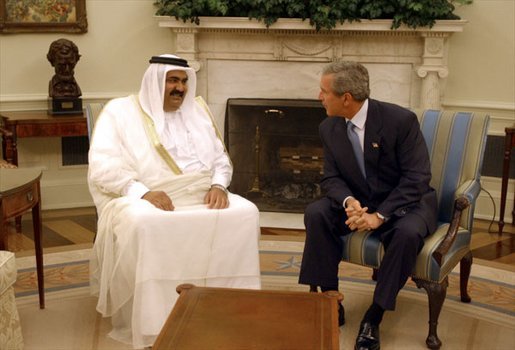 President George W. Bush meets with Amir Hamad bin Khalifa Al Thani of Qatar in the Oval Office Thursday, May 8, 2003. "I would like to thank the President very much for his gracious invitation for me to come and meet with him here at the White House," said the Amir during the two leaders' address to the media. "We in Qatar are very keen to have a very unique and strong and distinct relationship with the United States, a relationship that it is transparent." White House photo by Paul Morse