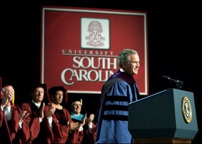  President George W. Bush discusses peace in the Middle East during his Commencement Address at the University of South Carolina in Columbia, S.C., Friday, May 9, 2003. "Across the globe, free markets and trade have helped defeat poverty, and taught men and women the habits of liberty," said the President. "So I propose the establishment of a U.S.-Middle East free trade area within a decade, to bring the Middle East into an expanding circle of opportunity, to provide hope for the people who live in that region." White House photo by Tina Hager. White House photo by Tina Hager