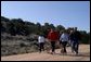 President George W. Bush and Laura Bush walk with Roland Betts, second left, and wife Lois Betts, and other guests Regan and Billy Gammon near the Bett's home outside Santa Fe, N.M., Saturday, May 10, 2003. White House photo by Susan Sterner