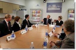 President George W. Bush discusses the tax cuts in his economic plan during a roundtable meeting with couples at Airlite Plastics in Omaha, Neb., Monday, May 12, 2003.   White House photo by Susan Sterner