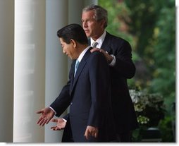 President George W. Bush and South Korean President Roh Moo-hyun in the Rose Garden on May 14, 2003.  White House photo by Paul Morse