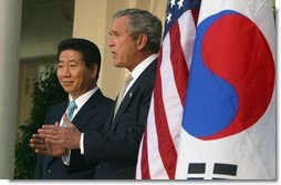 President George W. Bush and South Korean President Roh Moo-hyun in the Rose Garden on May 14, 2003.  White House photo by Paul Morse