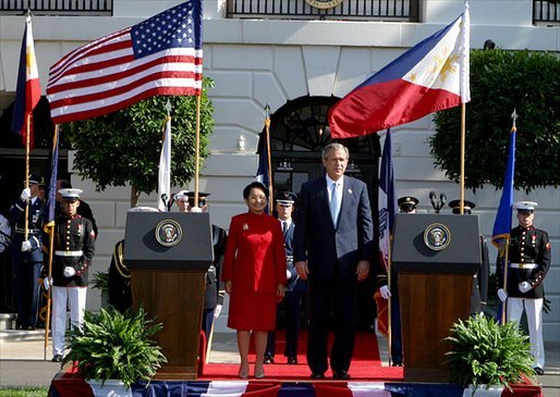 President George W. Bush hosts a State Arrival Ceremony for President Gloria Arroyo of the Philippines on the South Lawn Monday, May 19, 2003. White House photo by Lynden Steele.