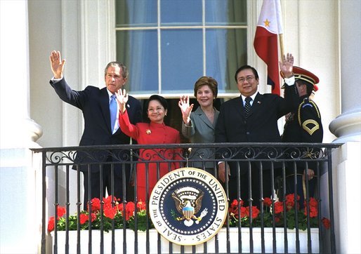 At the end of the ceremony, President Bush, Mrs. Bush, President Arroyo and Mr. Arroyo wave from the Truman Balcony. White House photo by Eric Draper