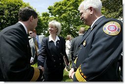 Interior Secretary Gale Norton greets firefighters after the President's remarks on his Healthy Forests Initiative in The East Garden Tuesday, May 20, 2003.  White House photo by Susan Sterner