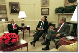 President George W. Bush meets with Senator John Danforth, the President's Special Envoy to the Sudan, center, and Secretary of State Colin Powell in the Oval Office Wednesday, May 21, 2003.  White House photo by Susan Sterner