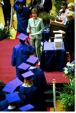 Mrs. Bush awards diplomas at the Fort Campbell High School Graduation at the Dunn Center at the Austin Peay State University in Fort Campbell, Ky., May 23, 2003.  White House photo by Tina Hager