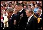 President George W. Bush, Major General James T. Jackson and Secretary of Defense Donald H. Rumsfeld (right) observe a 30-second moment of silence after a wreath-laying ceremony at the Tomb of the Unknown Soldier at Arlington National Cemetery on Memorial Day. Monday, May 26, 2003. White House photo by Tina Hager.