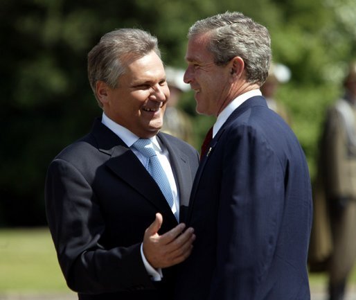 President George W. Bush and President of Poland Aleksander Kwasniewski talk during the President's trip to the Wawel Royal Palace in Krakow, Poland, Saturday, May 31, 2003. White House photo by Paul Morse