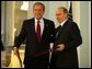 President George W. Bush and Russian President Vladimir Putin after exchanging documents of ratification inside the Konstantin Palace after a private meeting in St. Petersburg, Russia, June 1, 2003.  White House photo by Paul Morse