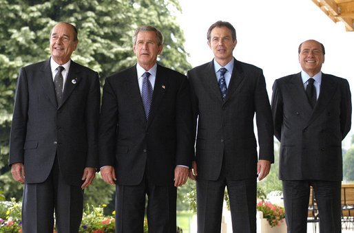 President George W. Bush poses with G8 leaders during the G8 Summit in Evian, France, Monday, June 2, 2003. From left, President Jacques Chirac of France, President Bush, Prime Minister Tony Blair of Great Britain and Prime Minister Silvio Berlusconi of Italy. White House photo by Eric Draper.